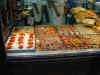 food pictures in the windows of the shops