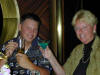 Couple on a cruise ship enjoying drinks including a blue martini