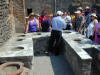 Pictures of Ancient Pompeii Italy - This is an ancient bar, the drinks were placed down in the holes to keep the drinks cool.