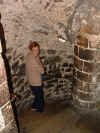 picture of a very narrow winding staircase in the Tower of London